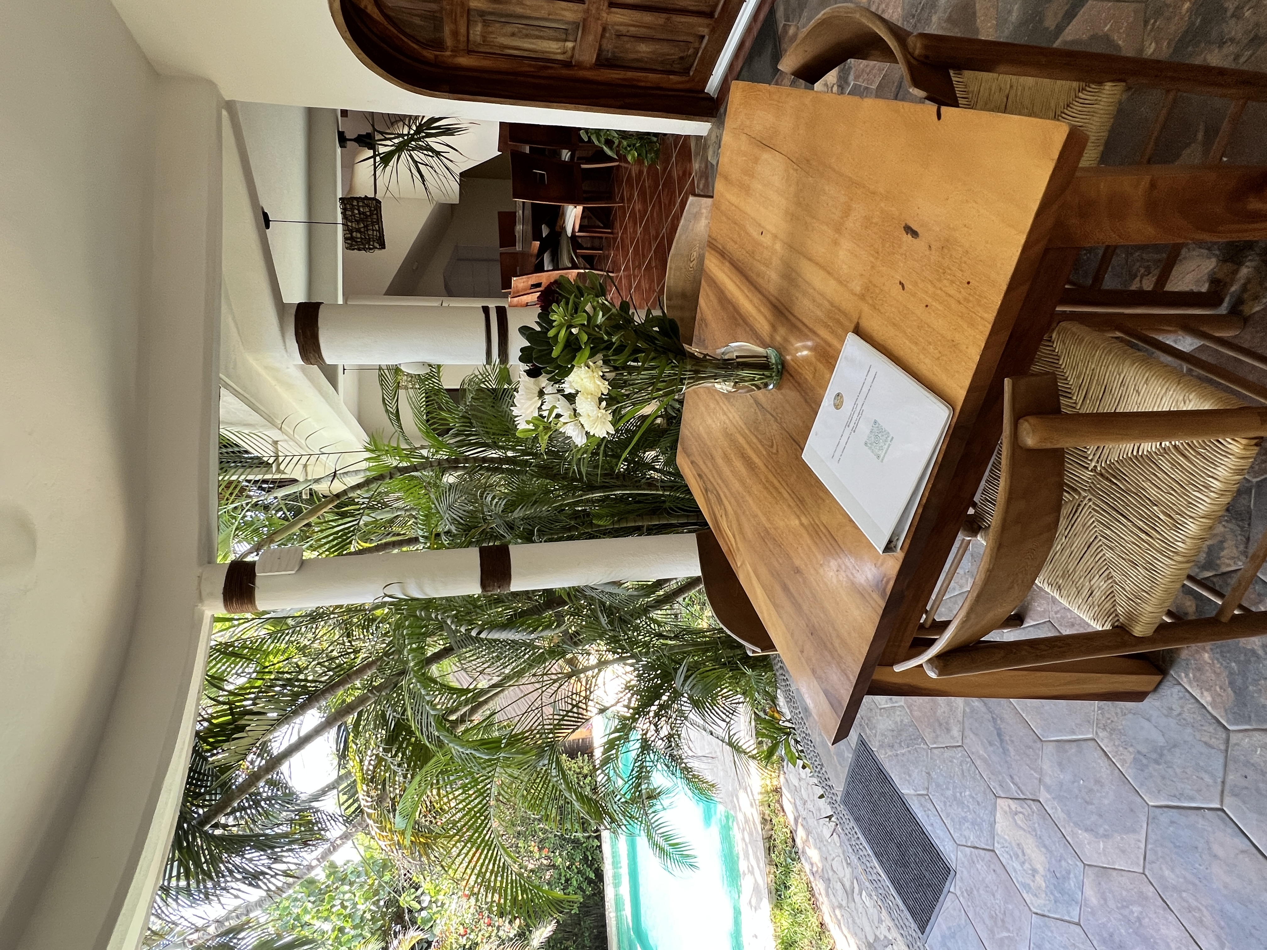 Outdoor dining area overlooking the pool